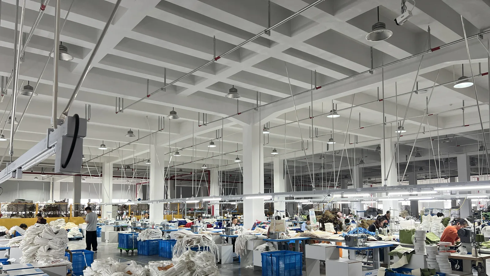 Industrial sewing floor producing straw and canvas bags at the LING YUN factory